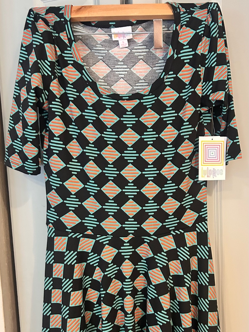 LuLaRoe Black Scoop Neck Top with Mint & Coral Geometric Print